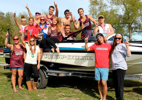 UW-L Water Ski Team pictured in front of a boat.