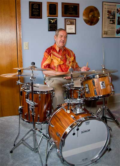 Tom Wirkus practices drums in a tiny room filled with awards he's received over the years. He was added to the International Listening Association Hall of Fame in 2011. 