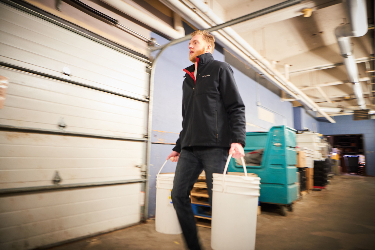 Jeremy carrying buckets. 