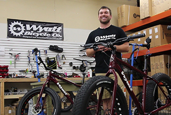 Wyatt pictured with one of his fat bikes at his shop.