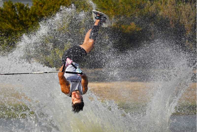  Joshua Wein mid flip during his trick run at the National Collegiate Water Ski Association Division II national championship competition in Martindale, Texas, Oct. 10-12.