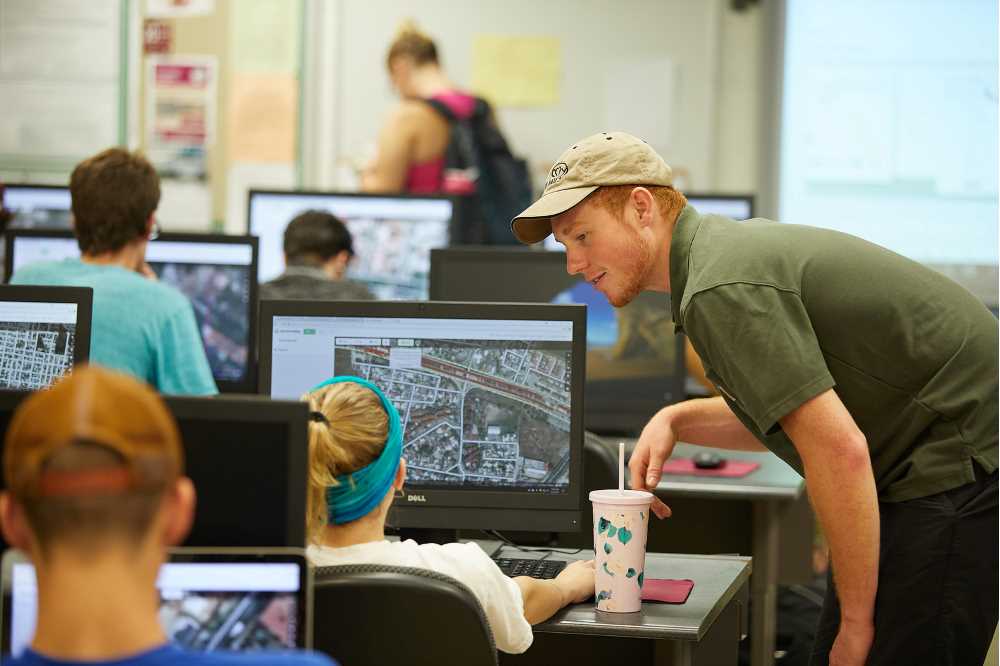 GIS Lab Assistant Helping a Student