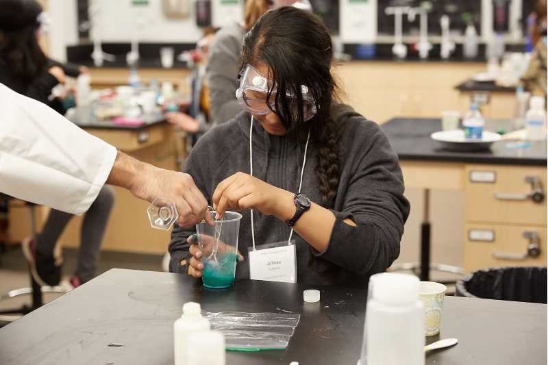 Student performing an experiment