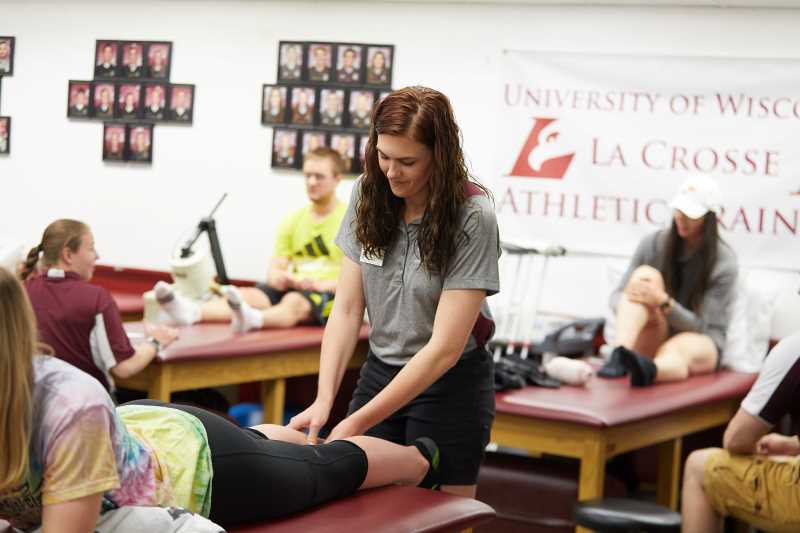 Athletic Training graduate students in a lab setting.