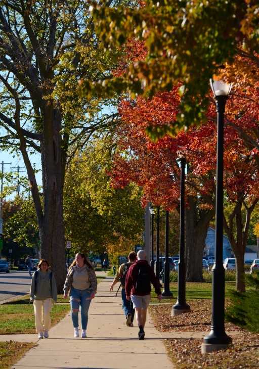 Students walking in fall on campus