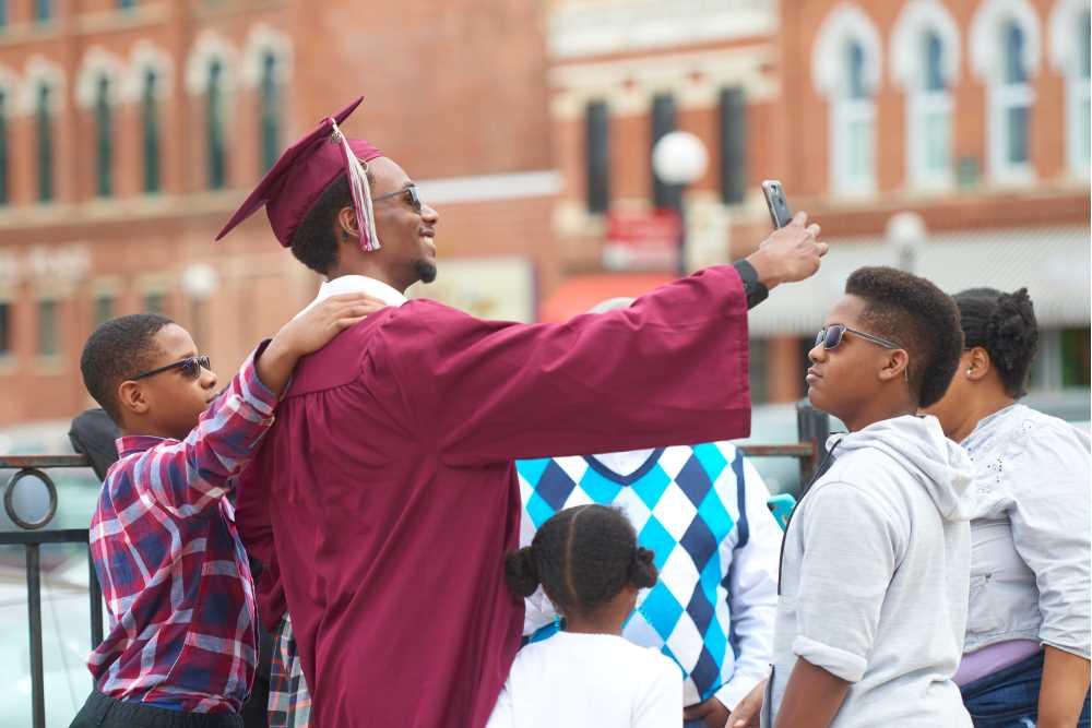 Graduate takes selfie with family