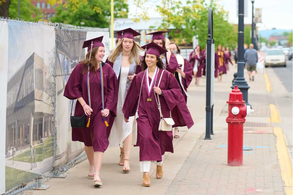 Graduates walking down the street